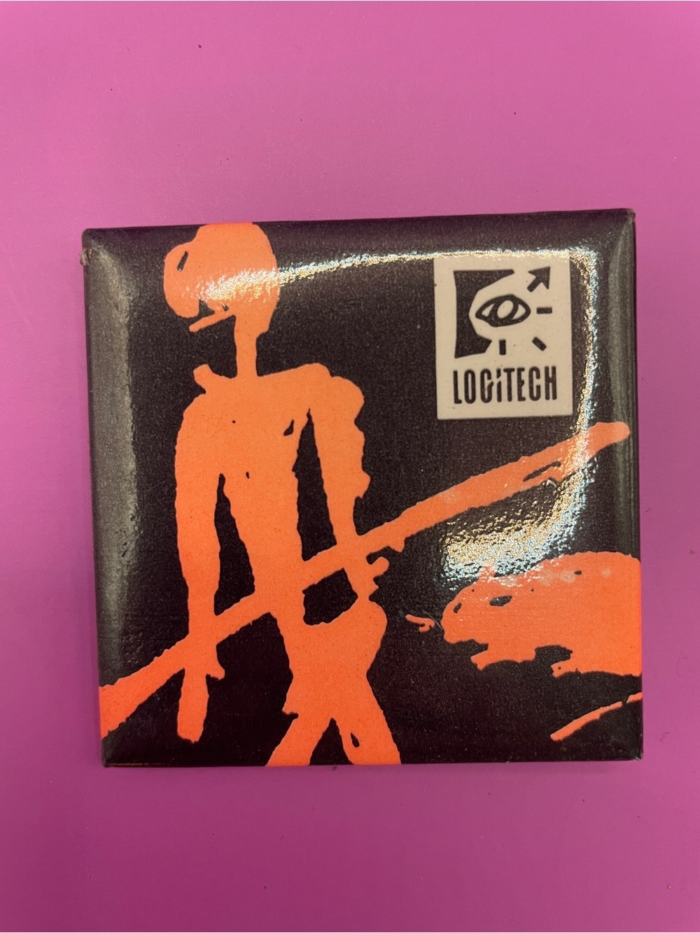 Logitech Black and Orange Graphic Button Pin
